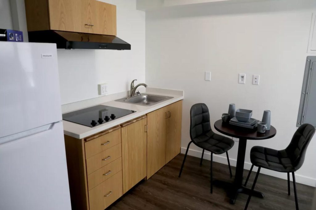 Interior of a new apartment focusing on a modern kitchen and dining area